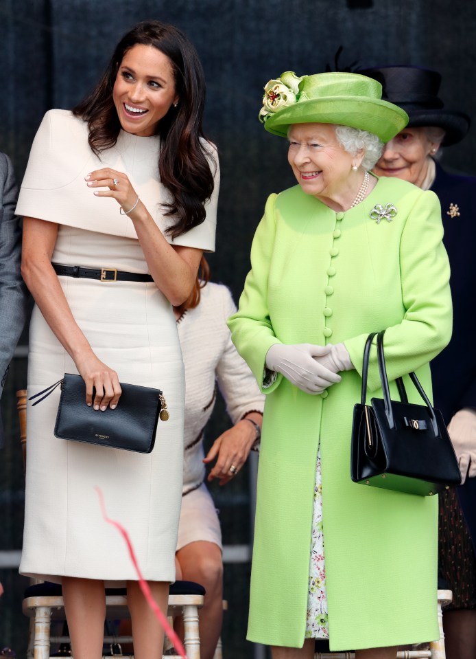 Meghan Markle and Queen Elizabeth II at a ceremony.