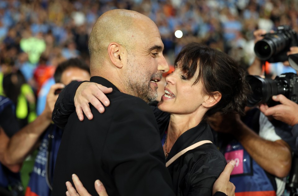 Pep Guardiola kissing his wife after Manchester City's Champions League victory.