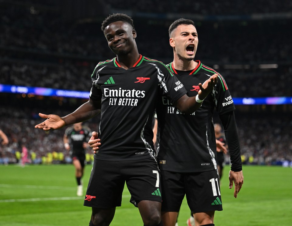 Arsenal's Saka and Martinelli celebrating a goal.