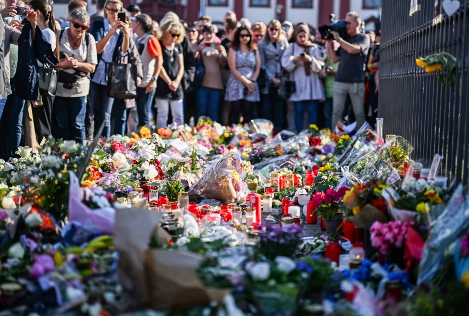 Memorial of flowers and candles following a fatal knife attack.