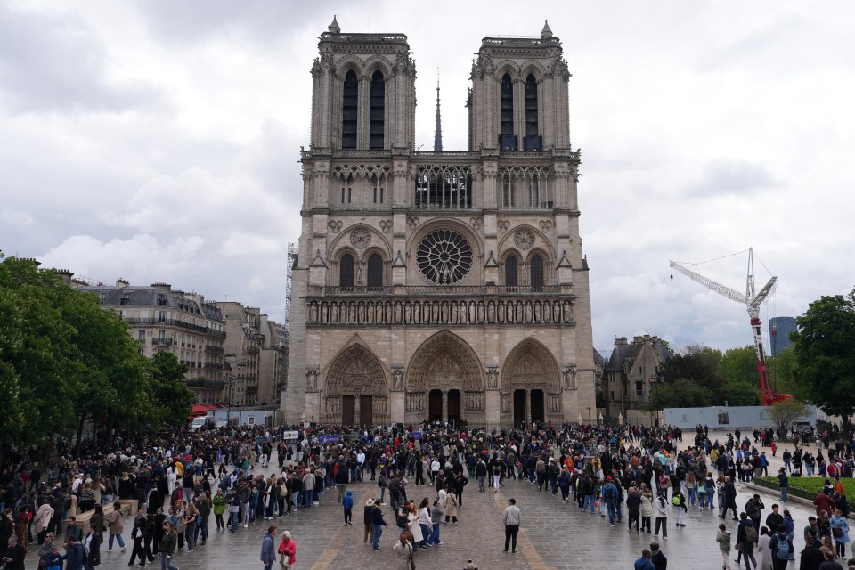 Mourners gather outside Notre-Dame Cathedral in Paris following the death of Pope Francis.