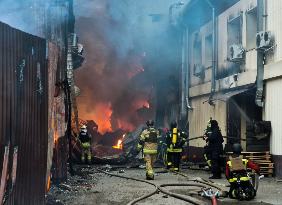 Firefighters battling a large fire in Kyiv, Ukraine.