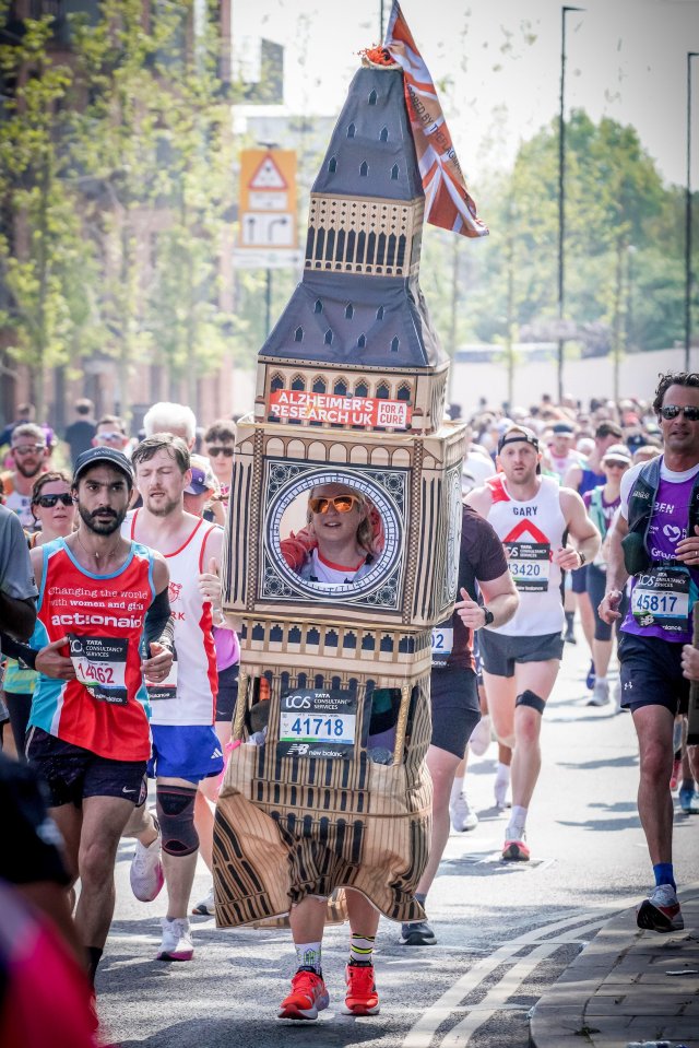 Runner dressed as Big Ben in a marathon.