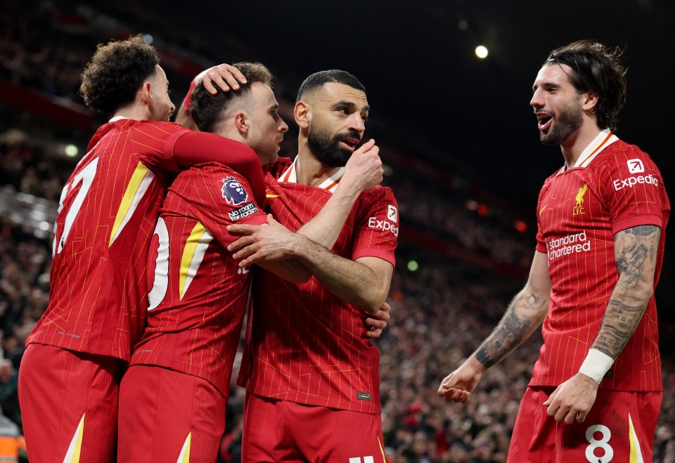 Liverpool players celebrating a goal.