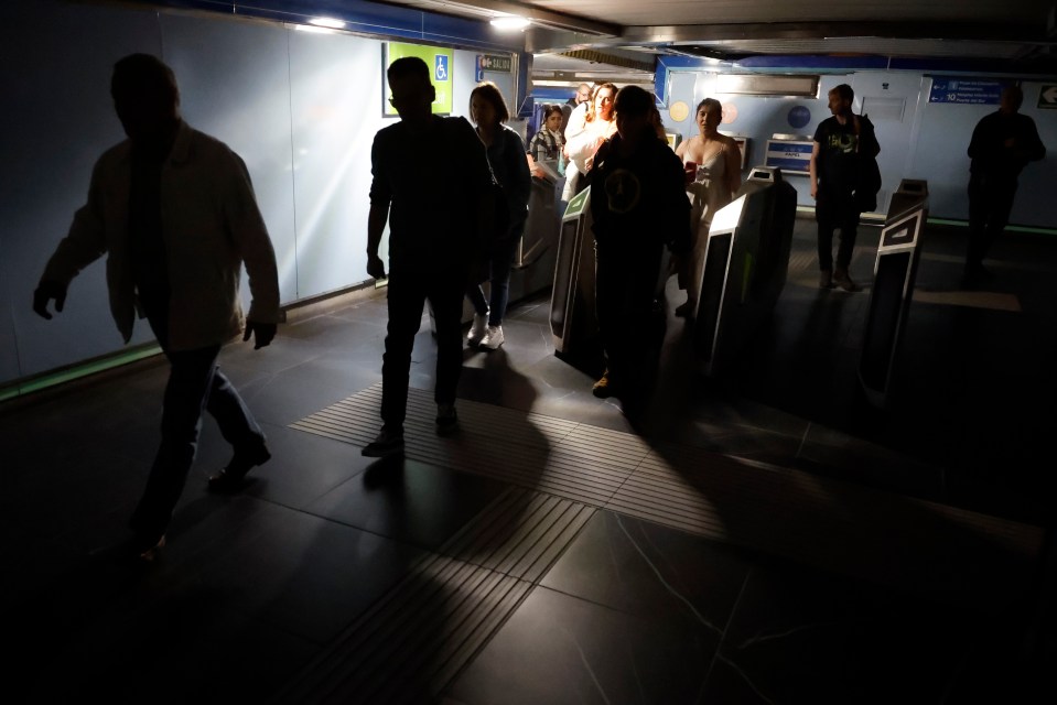 Commuters leaving a subway station during a blackout.
