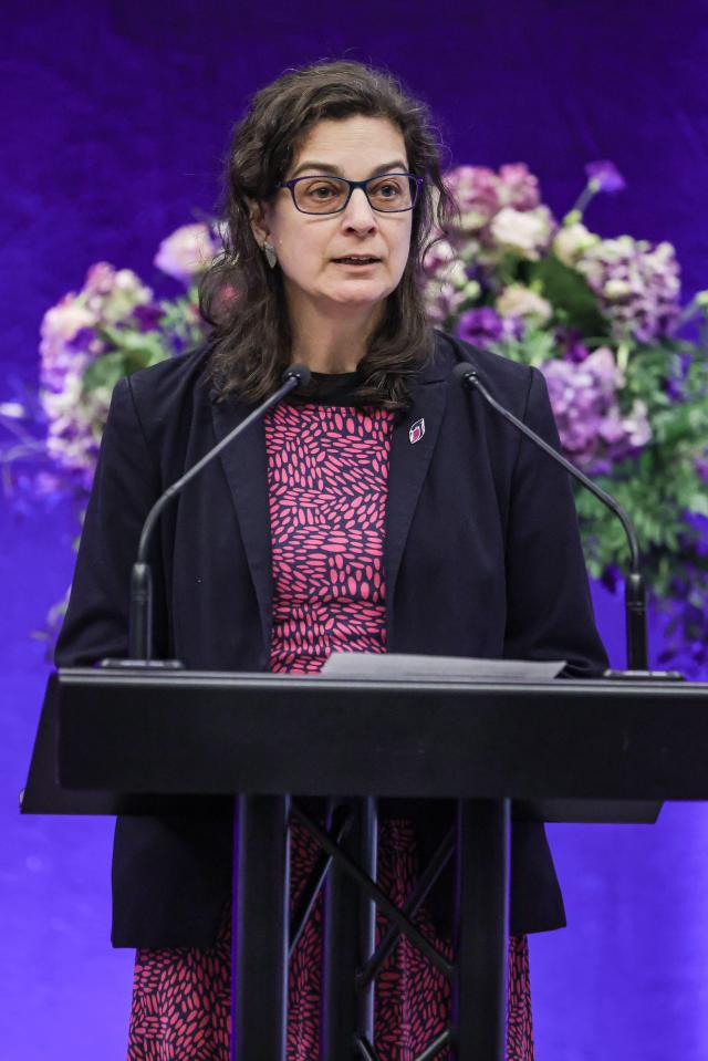 Olivia Marks-Woldman speaking at a Holocaust Memorial Day service.