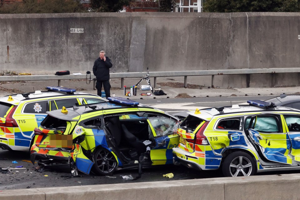 Damaged police cars at a crash scene.