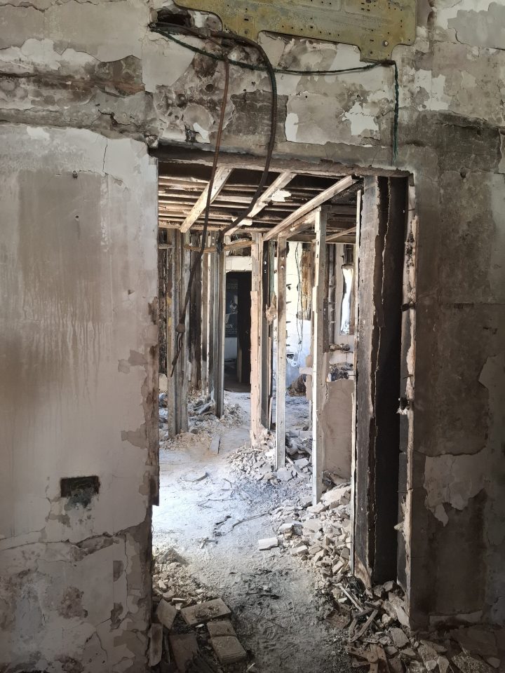 Damaged doorway in a dilapidated building.