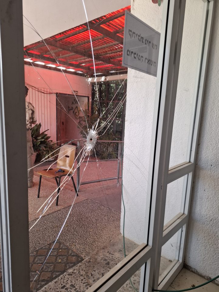 Bullet hole in a glass door.