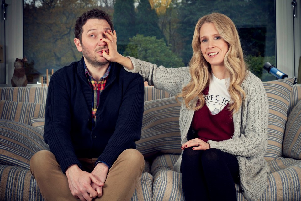 Jon Richardson and Lucy Beaumont sitting on a couch.