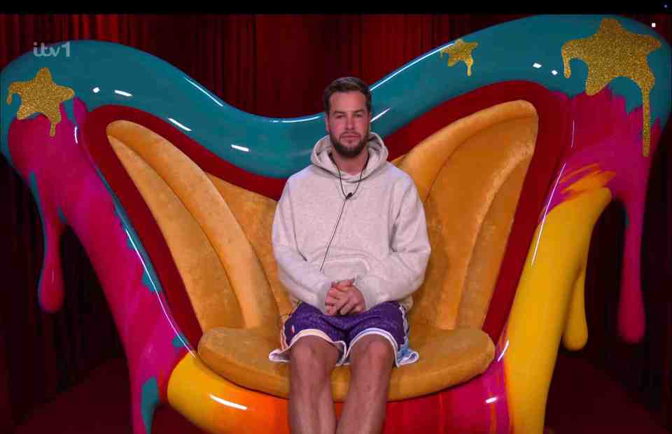 Chris Hughes sitting in a colorful chair.