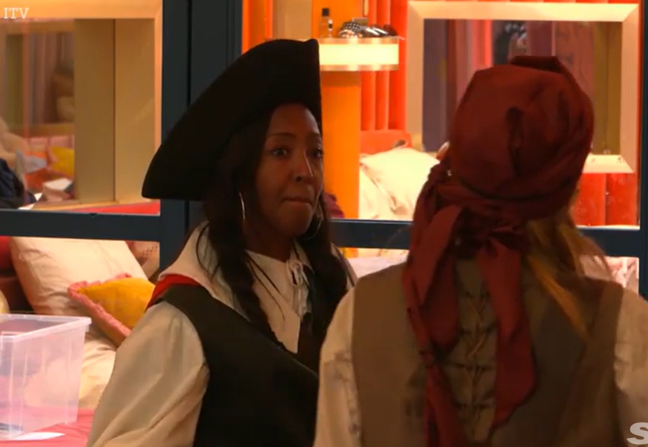 Screenshot of two women in costume in the Celebrity Big Brother house.