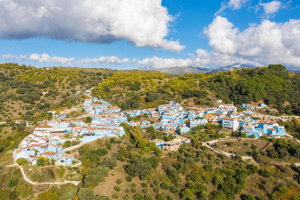Aerial view of Juzcar, a village in Spain with blue houses.