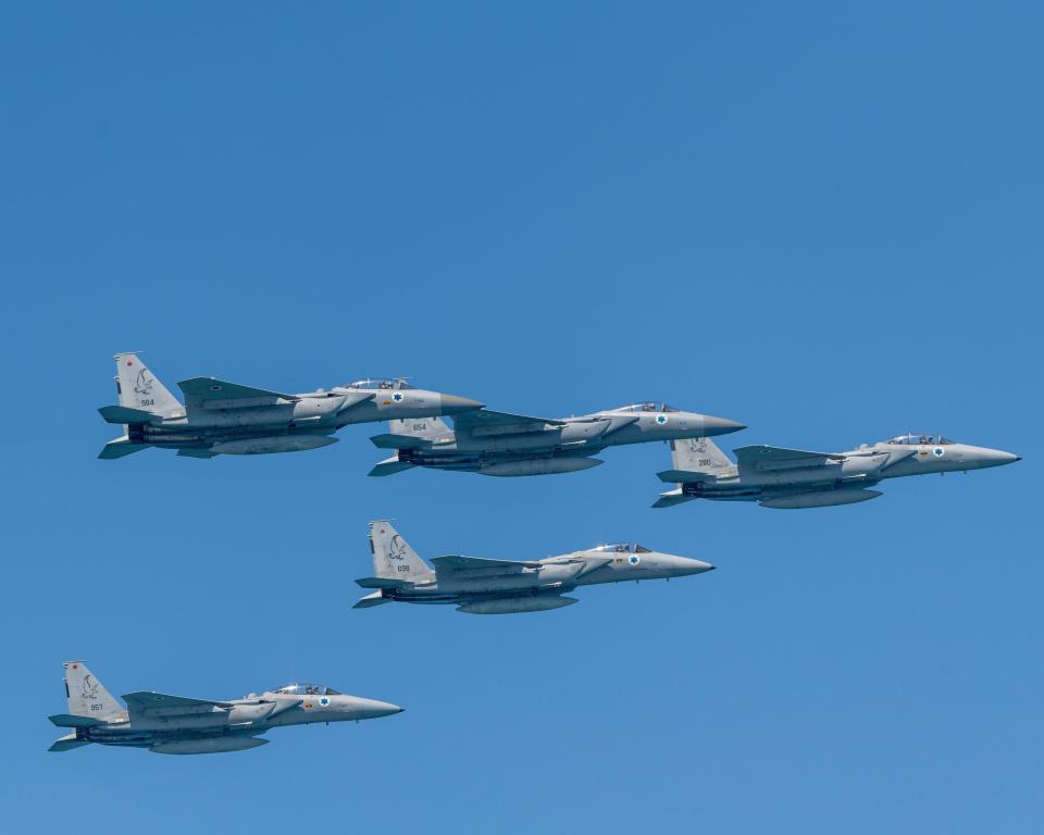 Four Israeli Air Force F-15 fighter jets in flight.