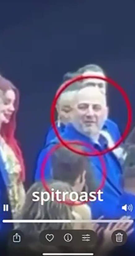 Screenshot of a video showing Wynne Evans and friends, with the word "spitroast" superimposed.