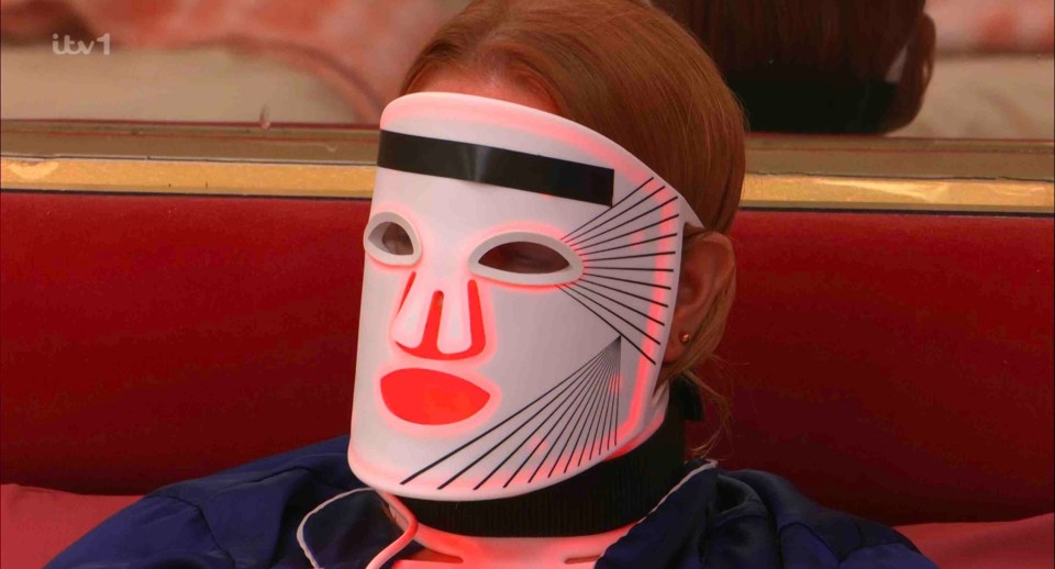 Woman wearing a light therapy mask.