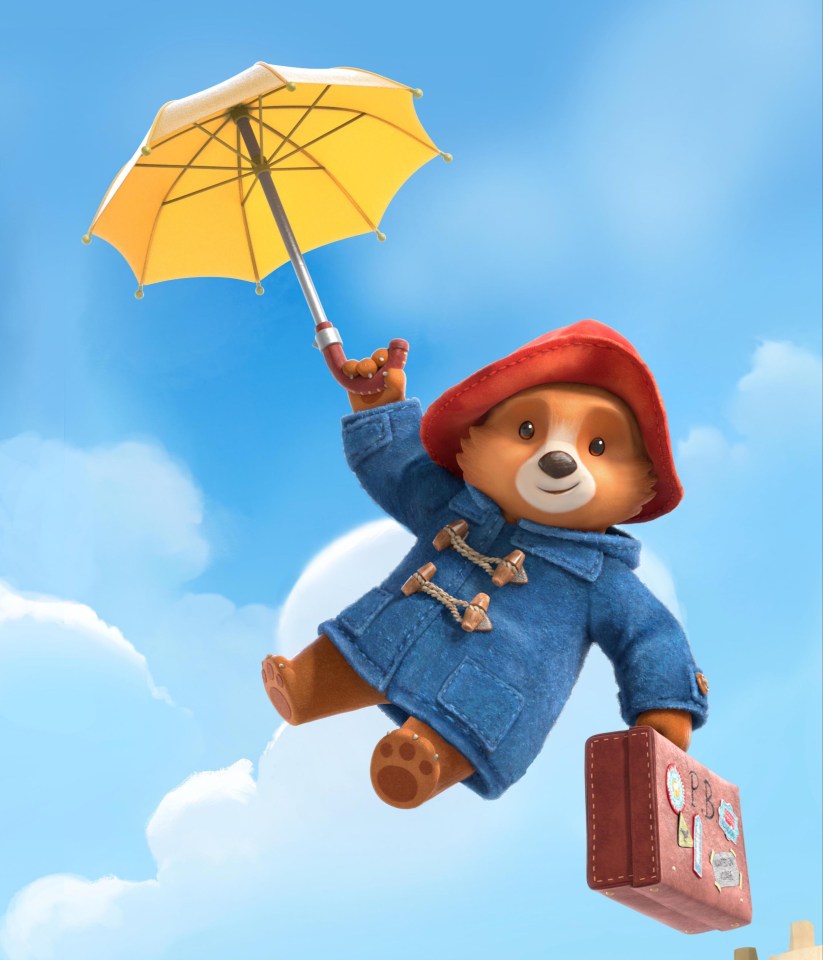 Illustration of Paddington Bear flying with an umbrella and suitcase.