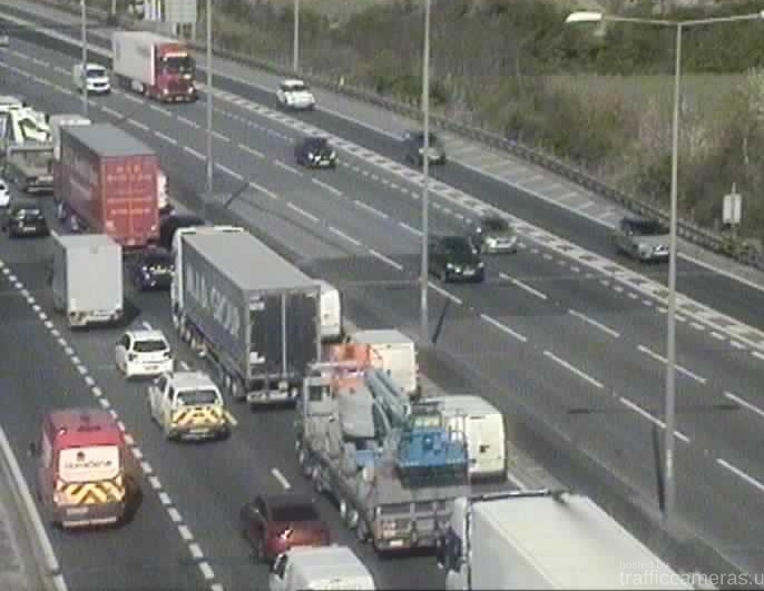 M25 traffic jam caused by a three-car crash.