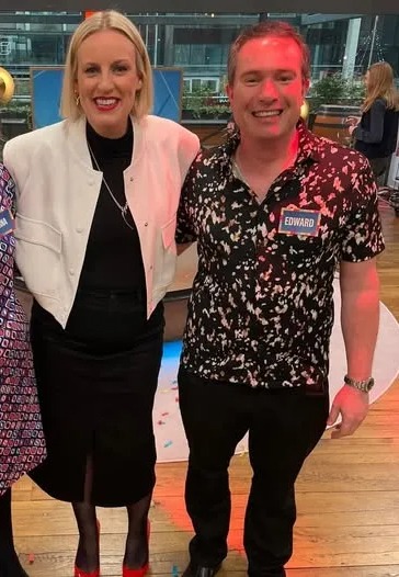 Photo of Edward Oldfield with two women on a game show.