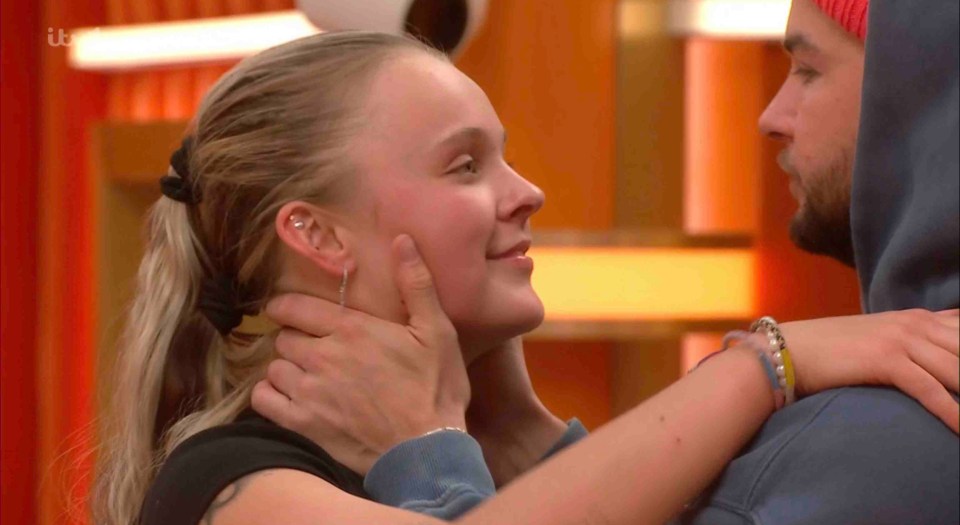 JoJo Siwa and Chris Hughes embracing.