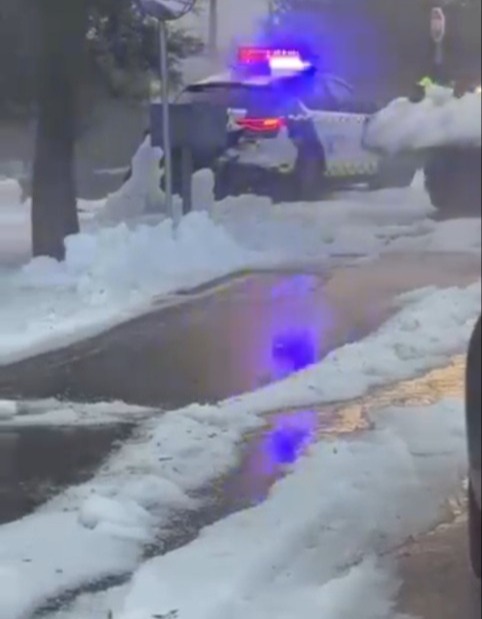 Police car in hail storm.