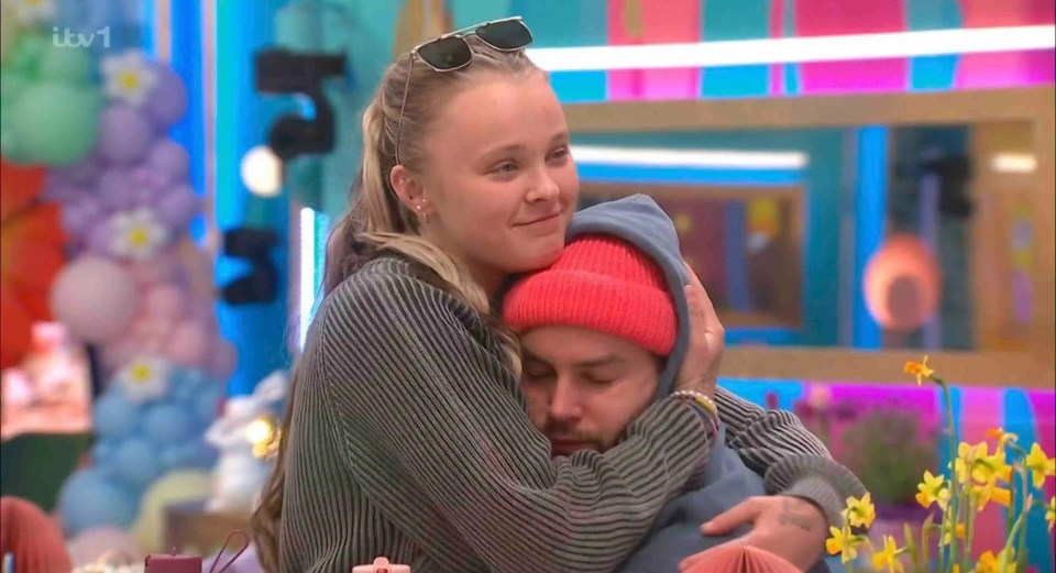 JoJo Siwa hugging Chris Hughes.