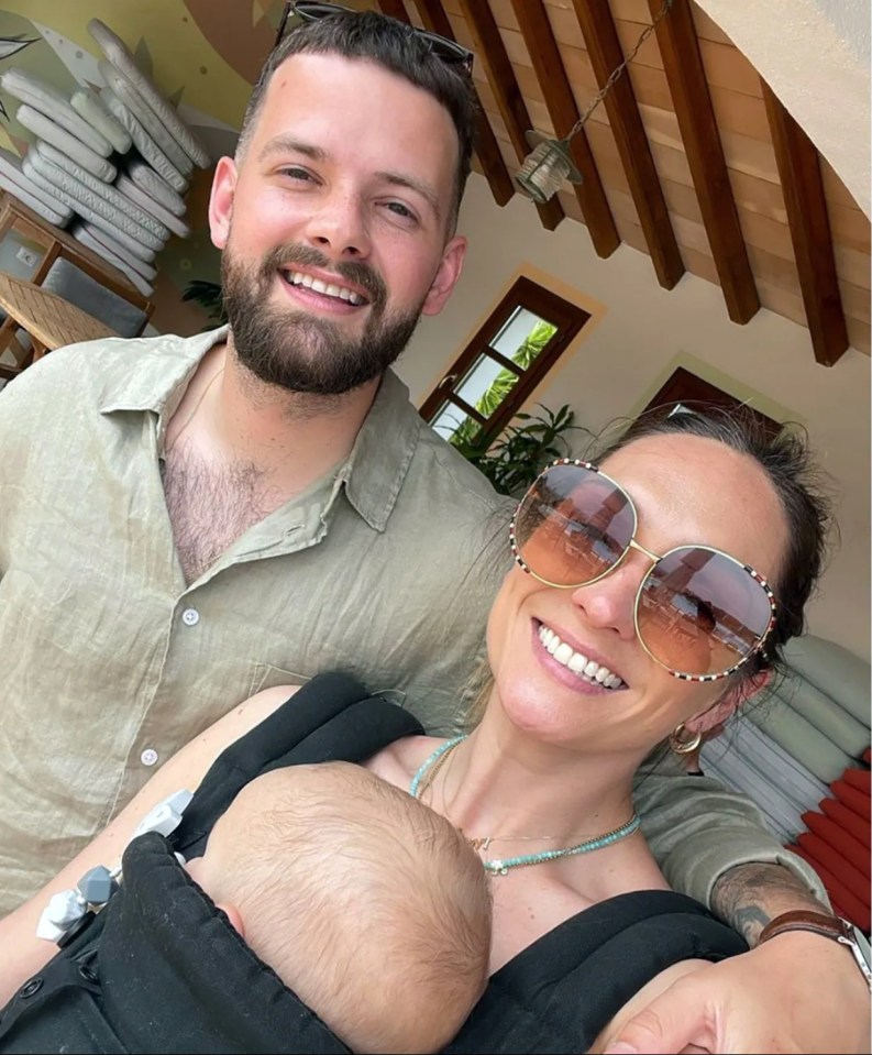 Photo of Tom Mann, Danielle Hampson, and their baby.