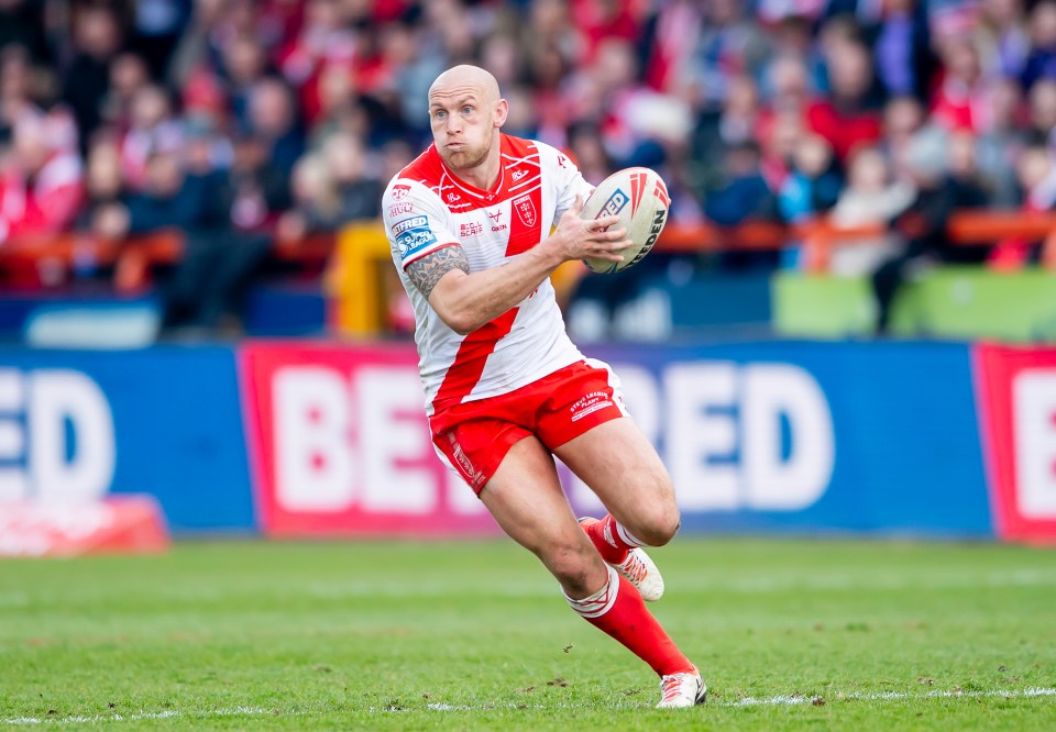 Rugby player running with the ball.