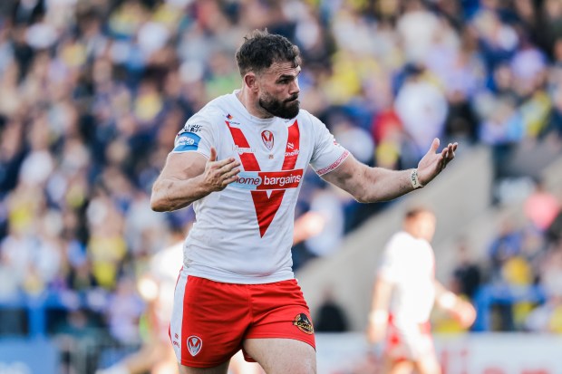 Alex Walmsley of St. Helens encourages fans.
