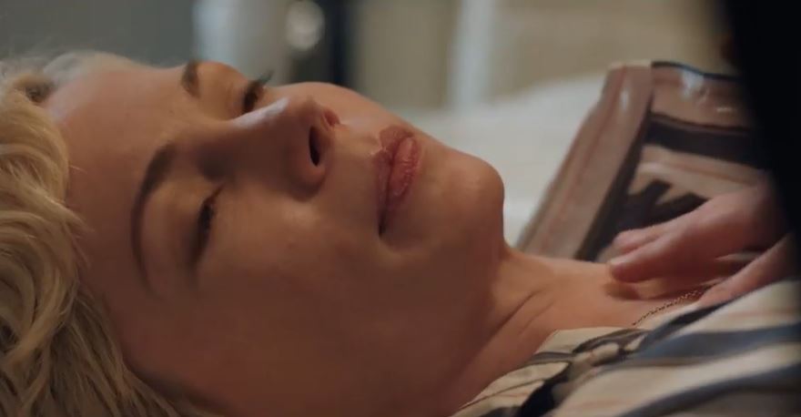 Woman lying down with eyes closed.