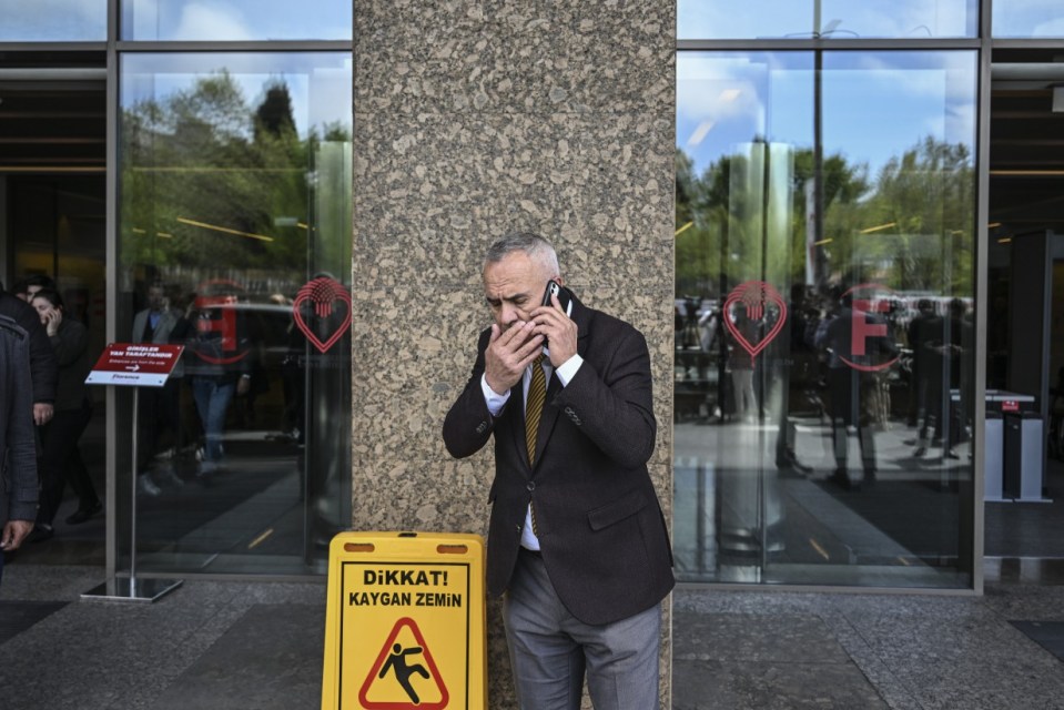 ISTANBUL, TURKIYE - APRIL 23: People leave the buildings in panic and call their loved ones after 6.2 magnitude earthquake jolts Istanbul, Turkiye on April 23, 2025. 6.2 magnitude earthquake jolts Turkiye, epicenter being Istanbul's Silivri district. (Photo by Murat Sengul/Anadolu via Getty Images)
