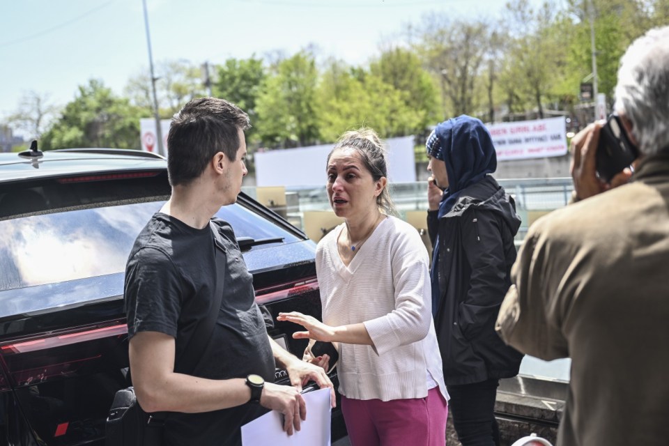 ISTANBUL, TURKIYE - APRIL 23: People leave the buildings in panic and call their loved ones after 6.2 magnitude earthquake jolts Istanbul, Turkiye on April 23, 2025. 6.2 magnitude earthquake jolts Turkiye, epicenter being Istanbul's Silivri district. (Photo by Murat Sengul/Anadolu via Getty Images)
