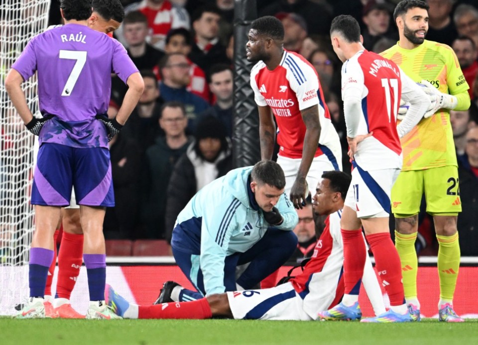 LONDON, ENGLAND - APRIL 01: Gabriel Magalhes of Arsenal receives treatment from Physio Simon Murphy during the Premier League match between Arsenal FC and Fulham FC at Emirates Stadium on April 01, 2025 in London, England. (Photo by David Price/Arsenal FC via Getty Images)