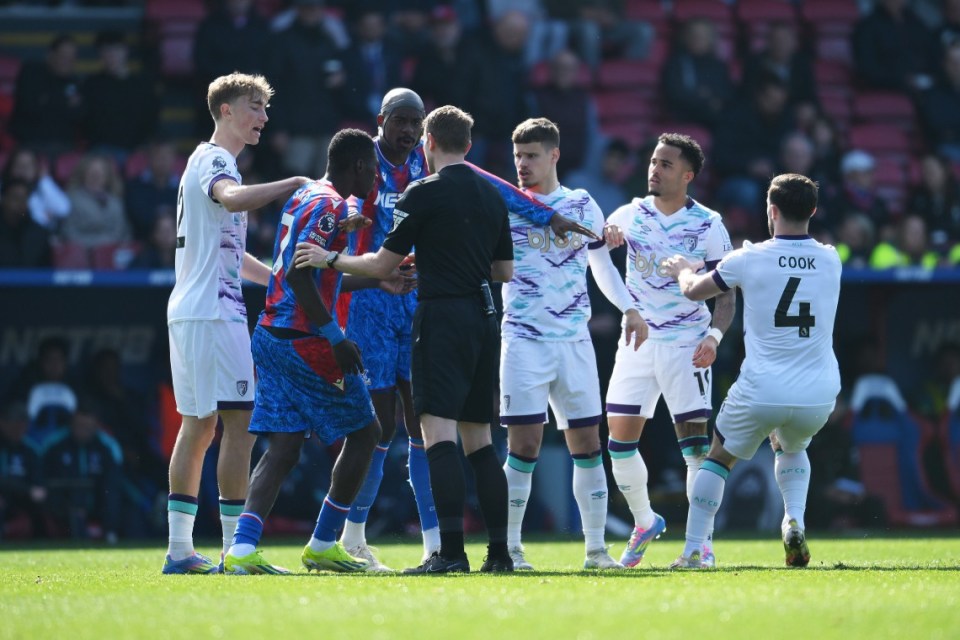 LONDON, ENGLAND - APRIL 19: Ismaila Sarr of Crystal Palace clashes with Justin Kluivert of AFC Bournemouth, as referee Samuel Barrott looks on during the Premier League match between Crystal Palace FC and AFC Bournemouth at Selhurst Park on April 19, 2025 in London, England. (Photo by Alex Broadway/Getty Images)