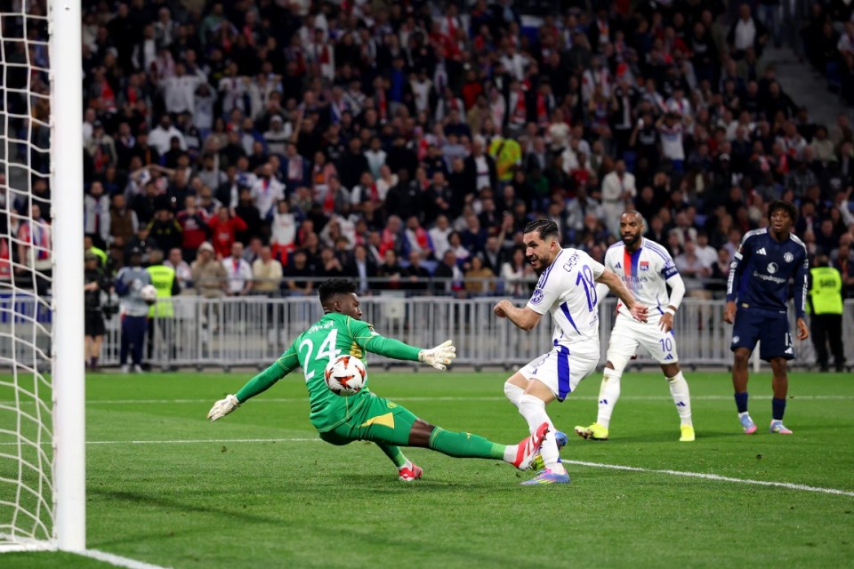 DECINES-CHARPIEU, FRANCE - APRIL 10: Rayan Cherki of Olympique Lyonnais scores his team's second goal past Andre Onana of Manchester United during the UEFA Europa League 2024/25 Quarter Final First Leg match between Olympique Lyonnais and Manchester United at OL Stadium on April 10, 2025 in Decines-Charpieu, France. (Photo by Michael Steele/Getty Images)