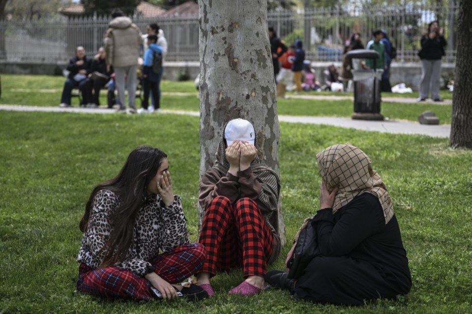 ISTANBUL, TURKIYE - APRIL 23: People evacuate buildings in panic and contact their loved ones after a 6.2 magnitude earthquake strikes Istanbul, Turkiye with the epicenter in Silivri district, on April 23, 2025. (Photo by Murat Sengul /Anadolu via Getty Images)