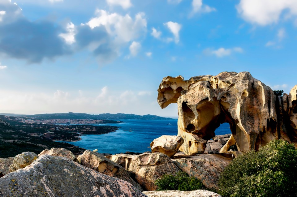Bear-shaped rock formation overlooking the sea.