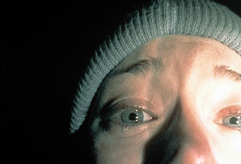 Close-up of a frightened woman's face from The Blair Witch Project.
