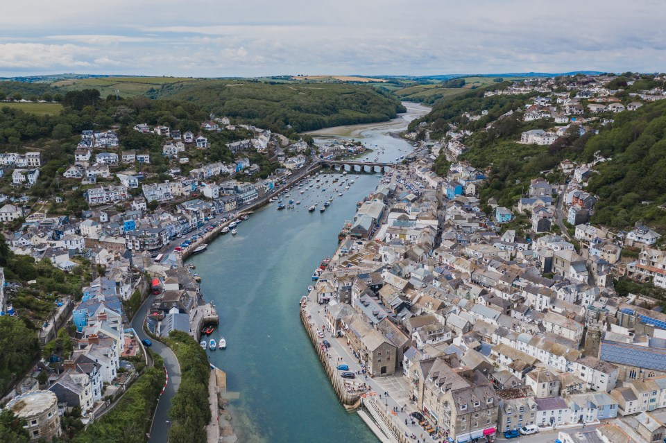 Aerial view of a coastal town with a river running through it.