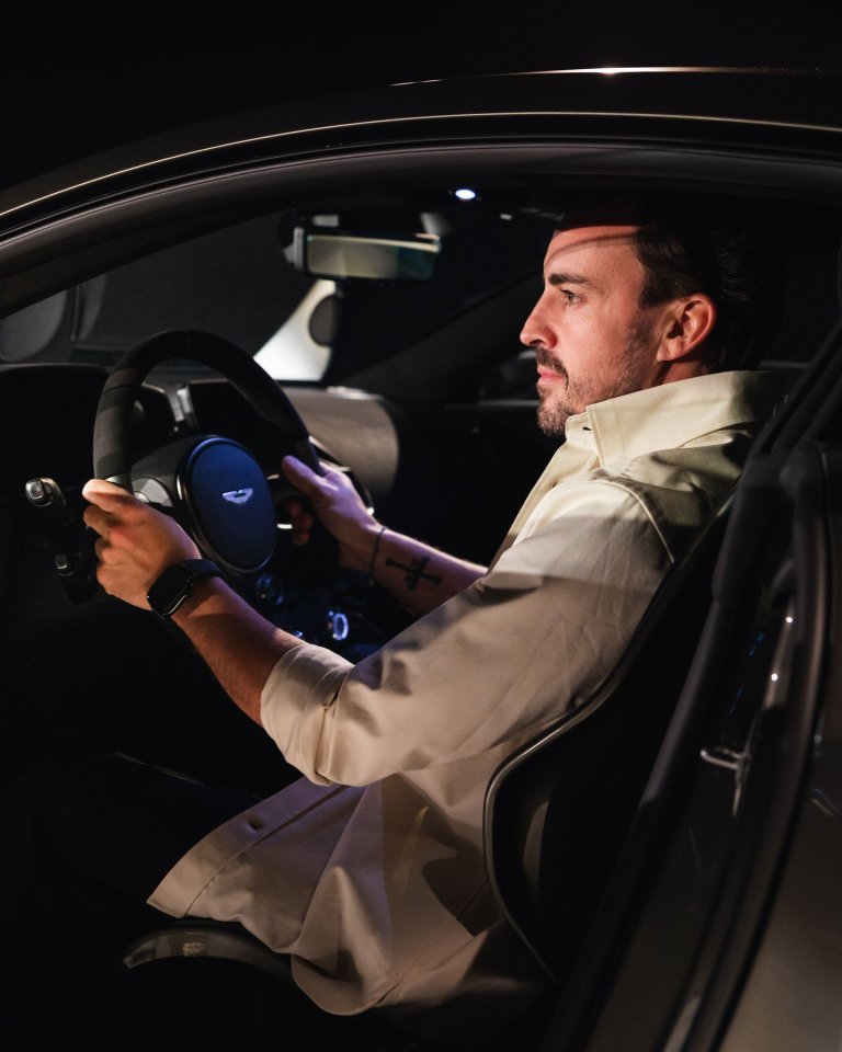 Fernando Alonso driving an Aston Martin.