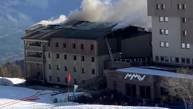 Firefighters battling a fire at a French ski resort hotel.