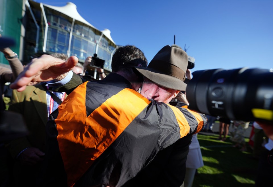 Jockey Patrick Mullins with his father and winning trainer Willie Mullins after winning the Randox Grand National Handicap Chase with Nick Rockett on day three of the Randox Grand National Festival at Aintree Racecourse, Liverpool. Picture date: Saturday April 5, 2025. PA Photo. See PA story RACING National. Photo credit should read: David Davies for The Jockey Club/PA Wire. RESTRICTIONS: Editorial Use only, commercial use is subject to prior permission from The Jockey Club/Aintree Racecourse.