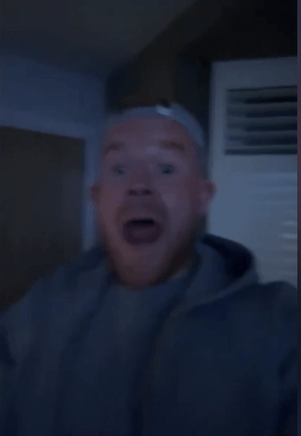 Screenshot of a man with a surprised expression.