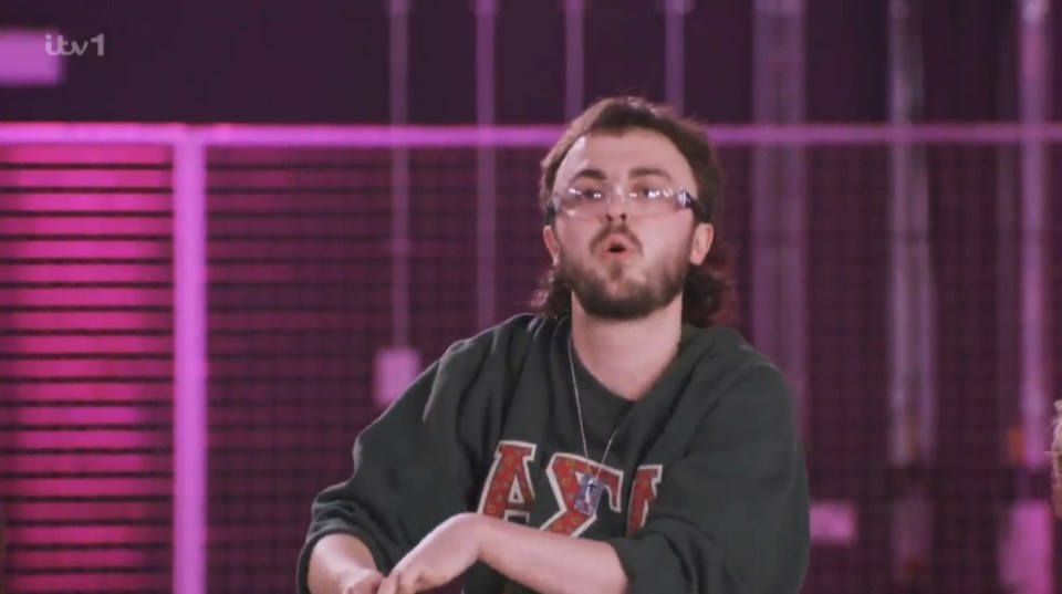 Screenshot of a young man speaking.