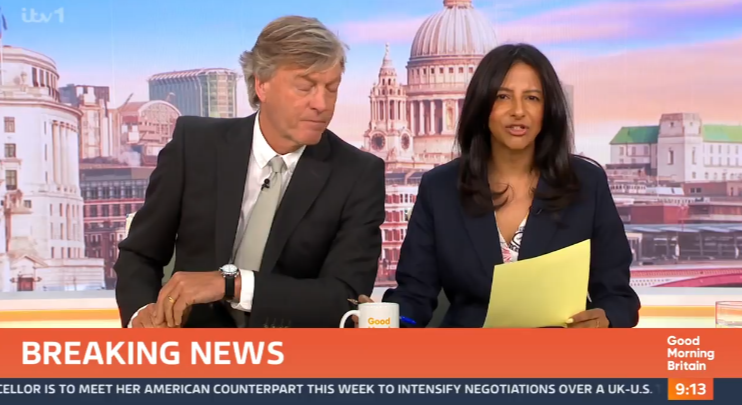 Screenshot of two news anchors presenting breaking news.