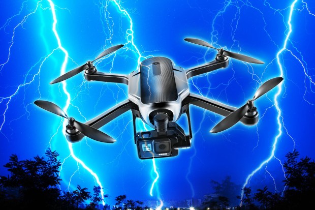 Drone with camera flying in a thunderstorm.