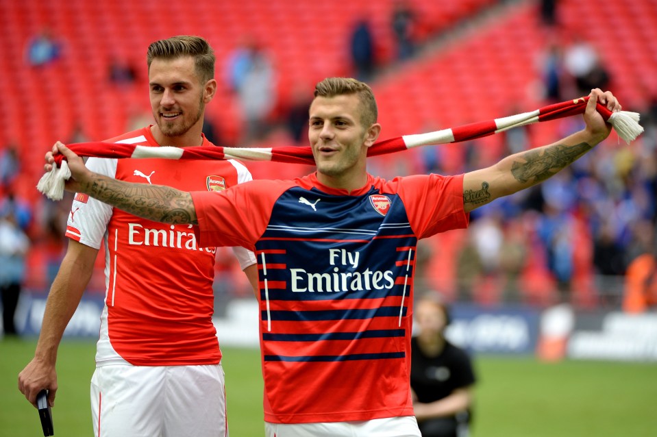 Aaron Ramsey and Jack Wilshere of Arsenal celebrating a win.