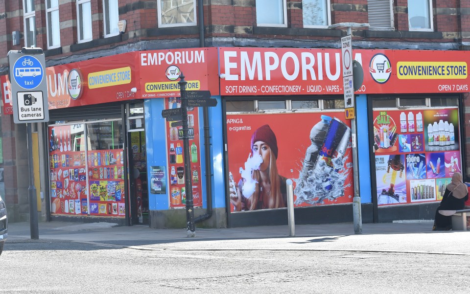 Emporium convenience store in Accrington, UK, selling vapes.