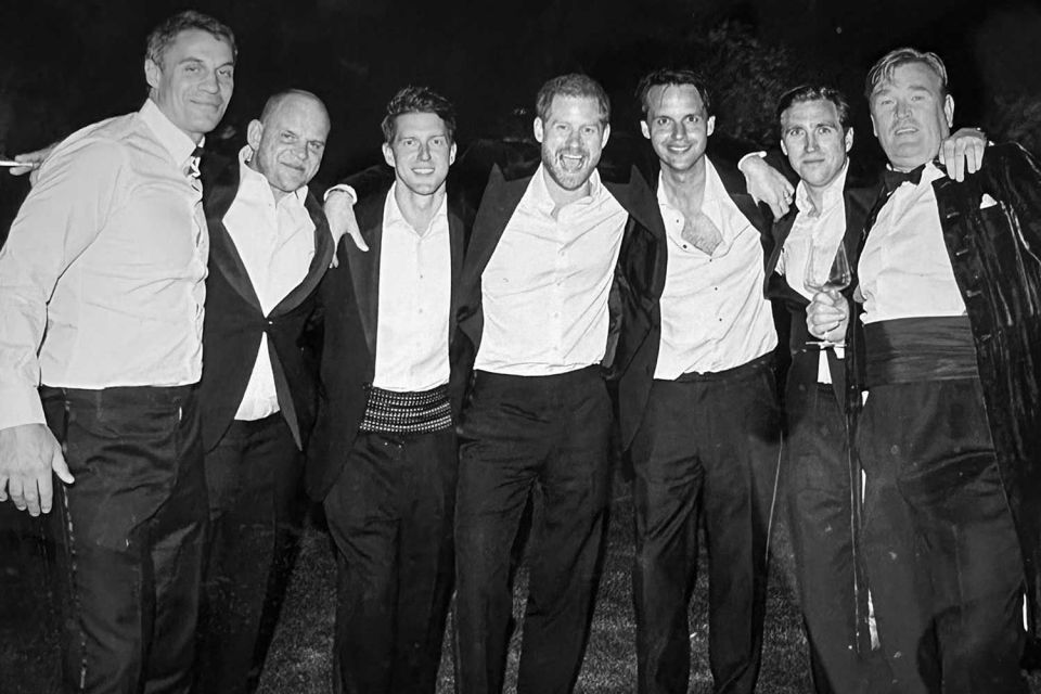 Black and white photo of Prince Harry and friends at his wedding.