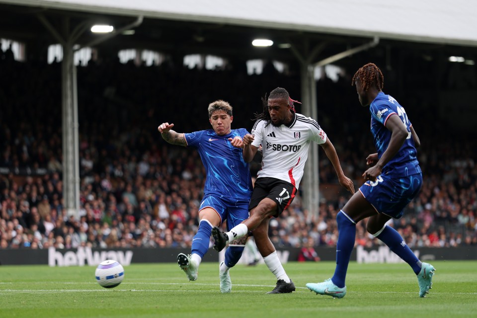 Alex Iwobi of Fulham scoring a goal during a Premier League match.